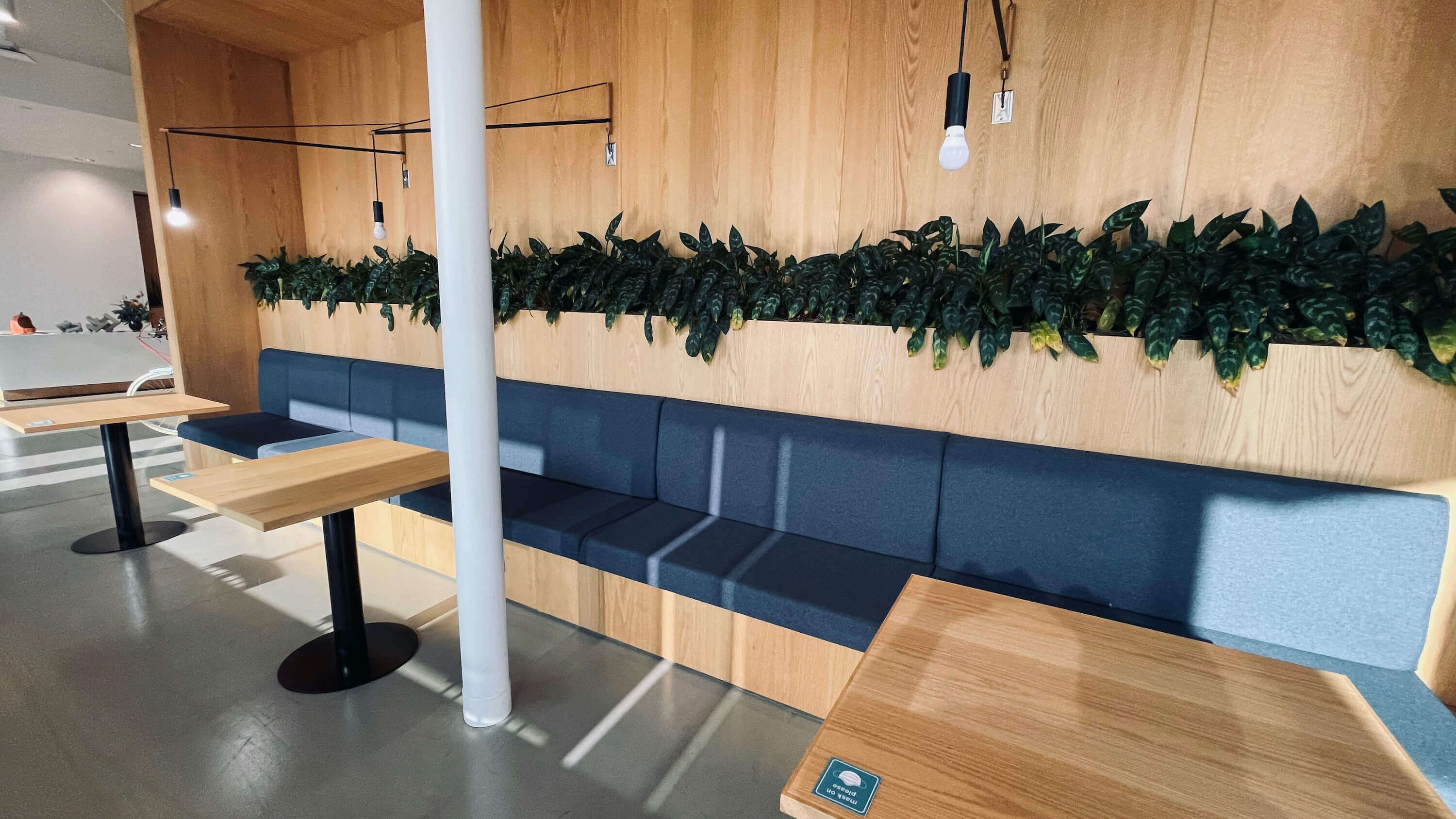 Banquette seating with built-in planters on the Main Floor at 1800 Vine St