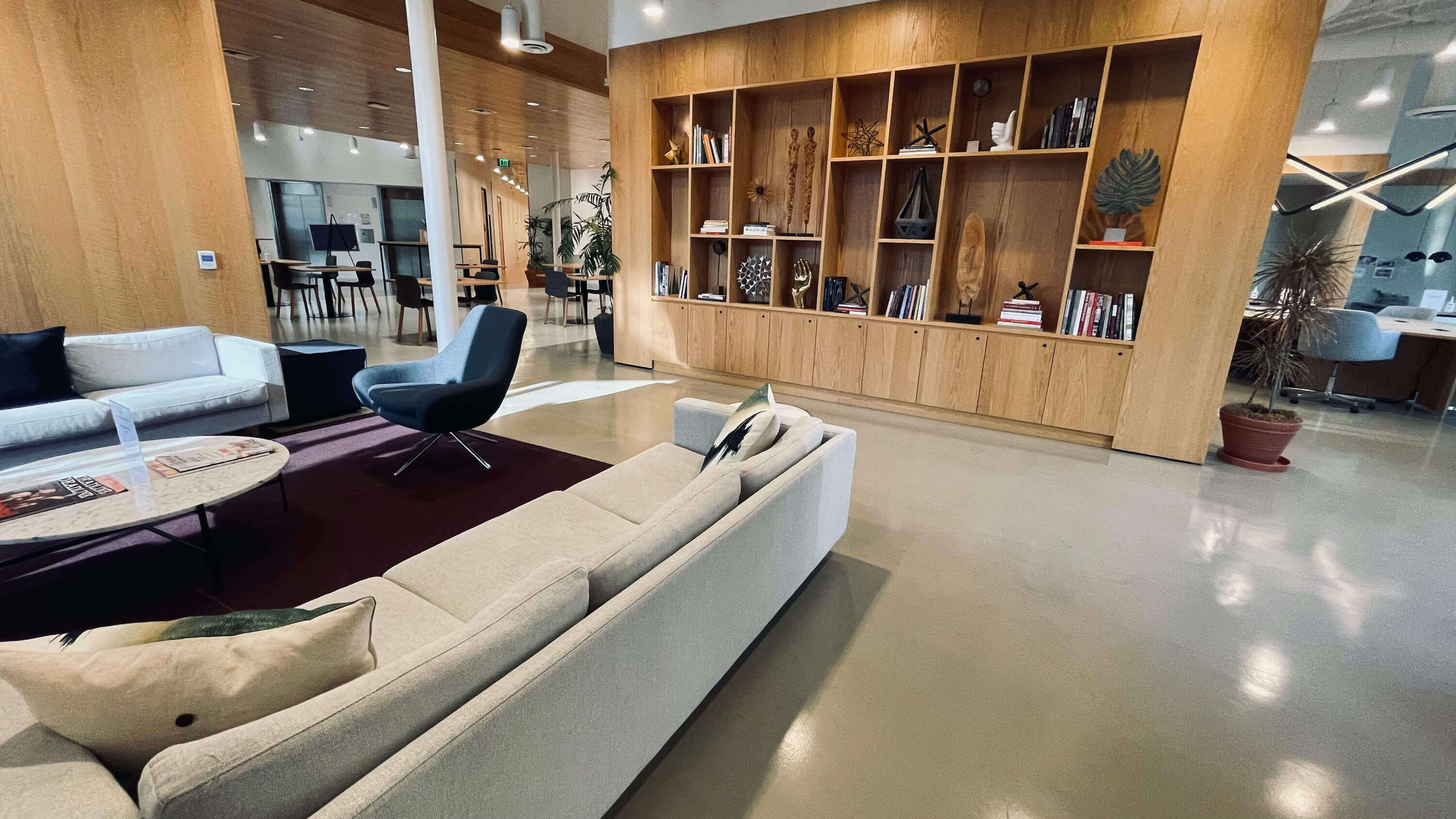 Lounge area with freestanding bookcase divider on the Main Floor at 1800 Vine St