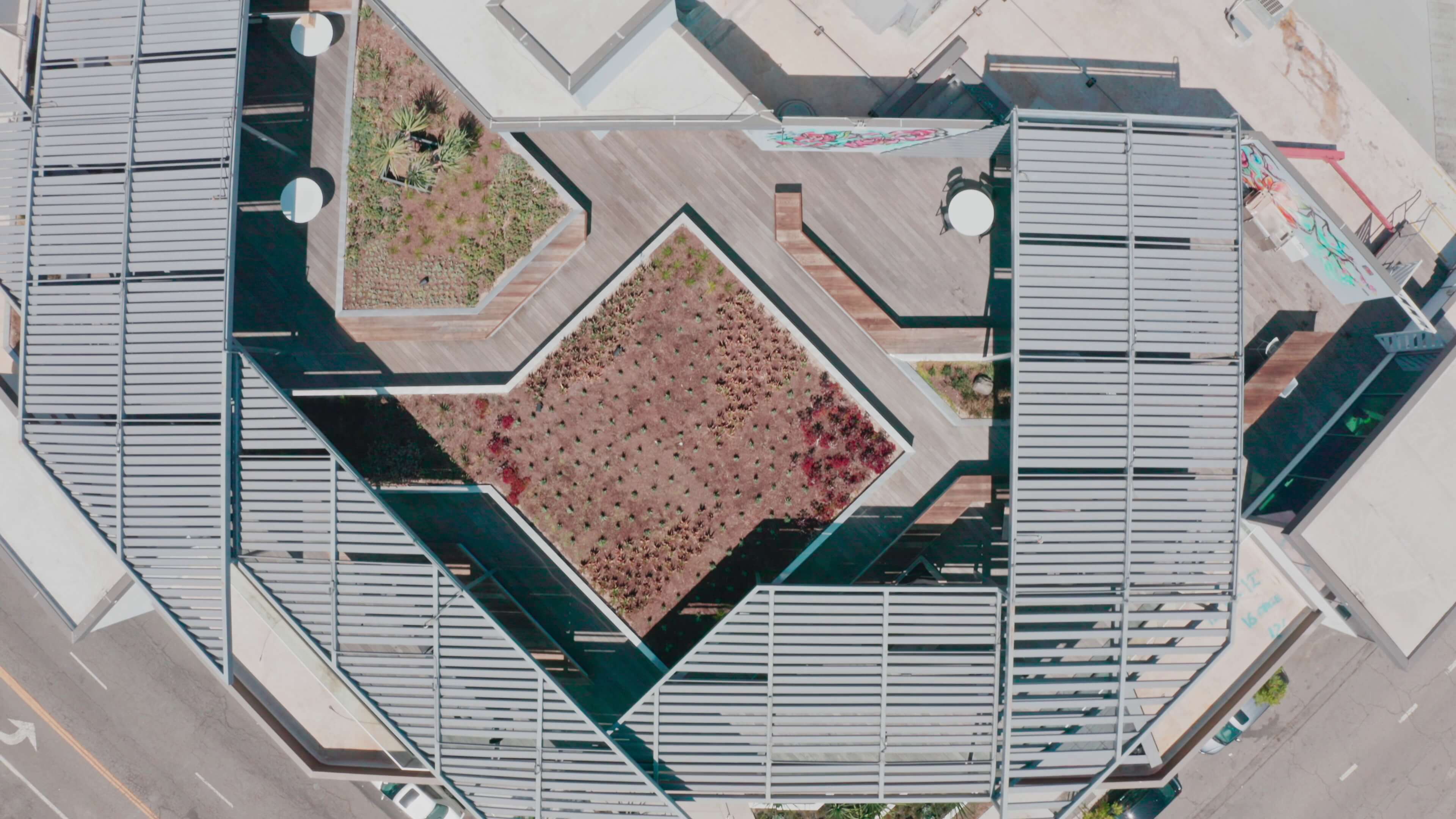 Top-down view of geometric planter layout and louvered pergola at 1800 Vine St