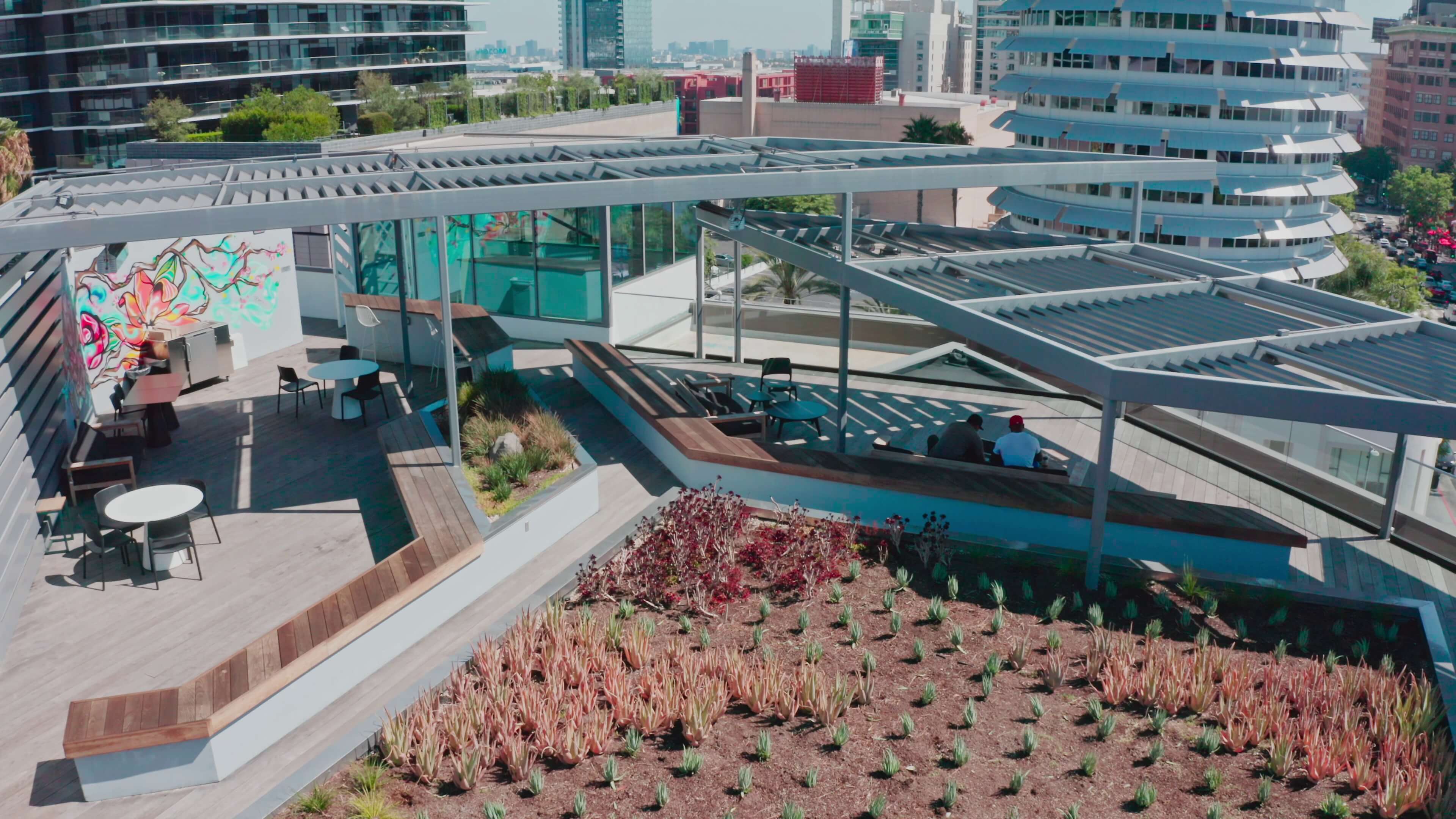 Shaded lounge seating with downtown views on the 1800 Vine St rooftop