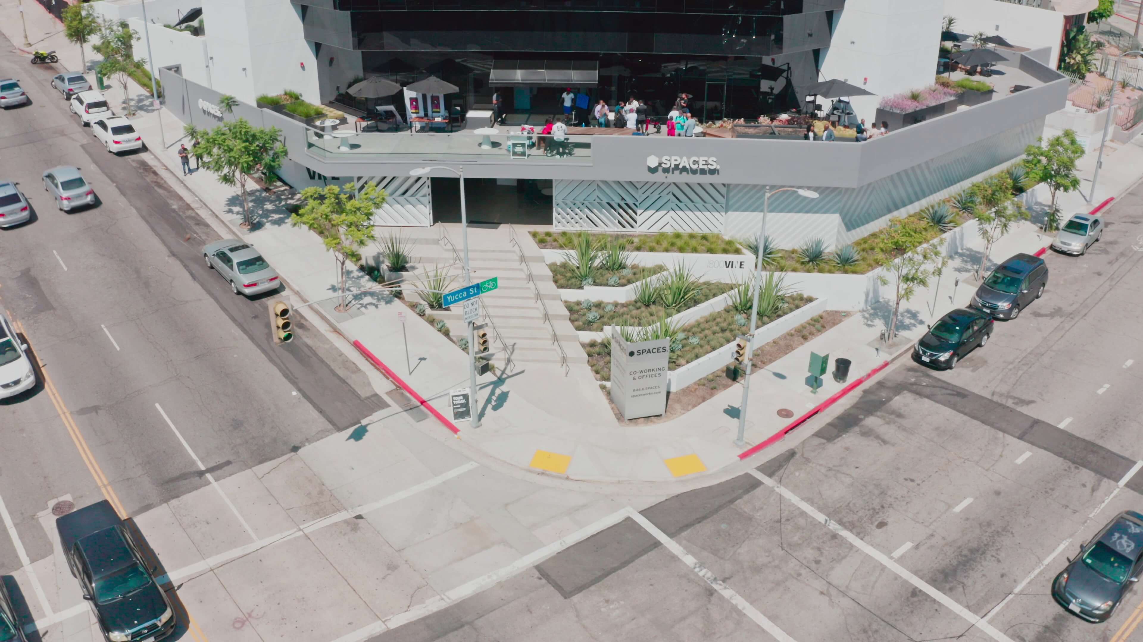 Angled aerial view of the corner building and Yucca St. Patio terrace at 1800 Vine St
